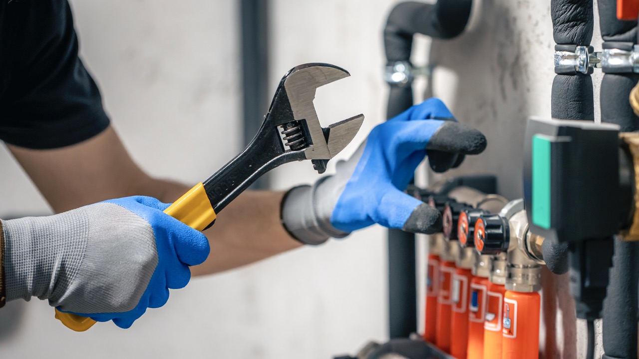 Skilled certified plumber working with precision tools in Dubai