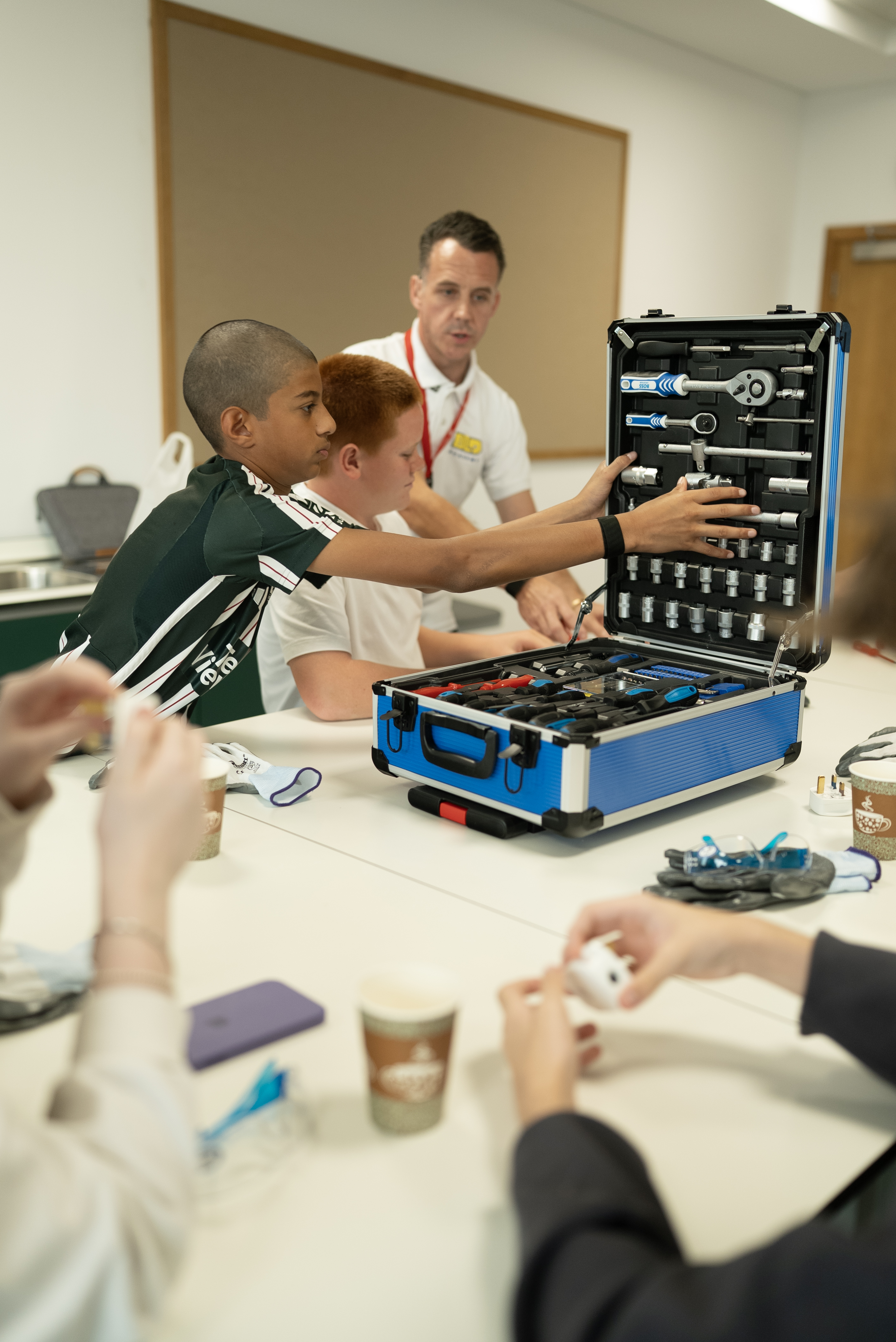 Workshop participants learning hands-on trade skills