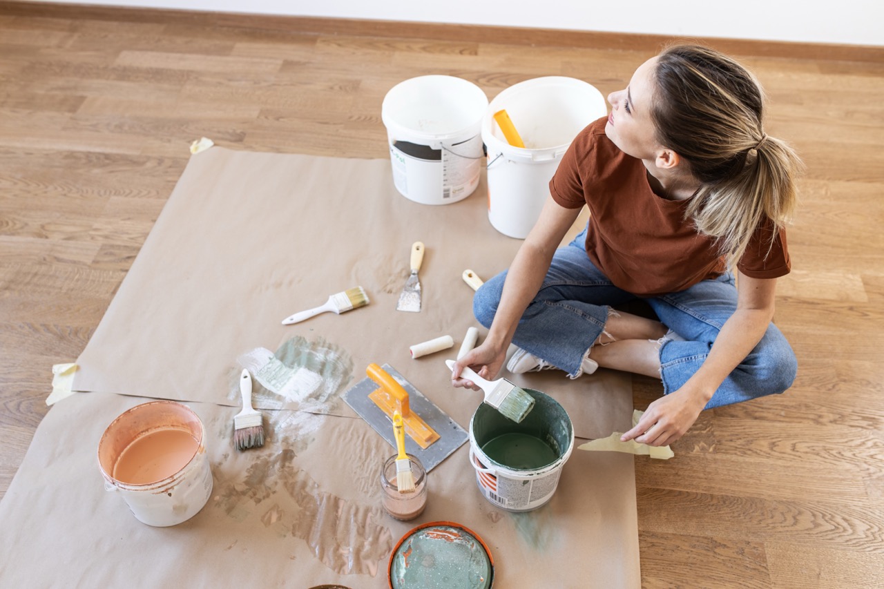 An adult preparing tools and materials for a practical home improvement project